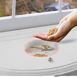 Window Sill Bird Feeder - 180° Clear View, Durable & Elegant 5 Adding bird food to an indoor bird feeder for easy bird watching from inside