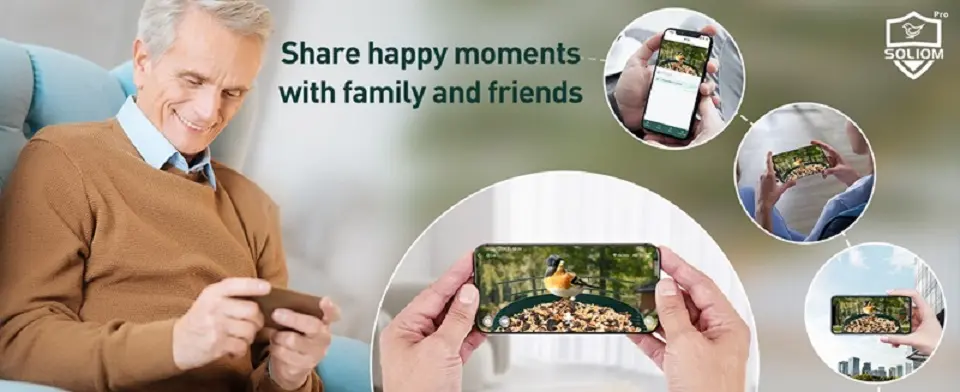 Solar Bird Feeder Camera - Metal with AI Bird ID & Live View 5 A man displays a phone featuring bird pictures, alongside a solar bird feeder, celebrating joyful times with family and friends
