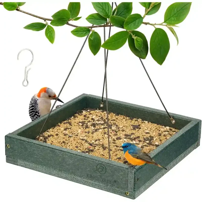 hanging platform bird feeder made from recycled plastic, filled with bird seed and attracting two wild birds